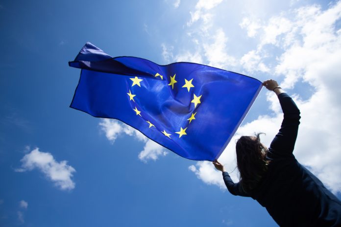 Young,Woman,Holding,European,Union,Flag.,Voting,,Election,Concept.